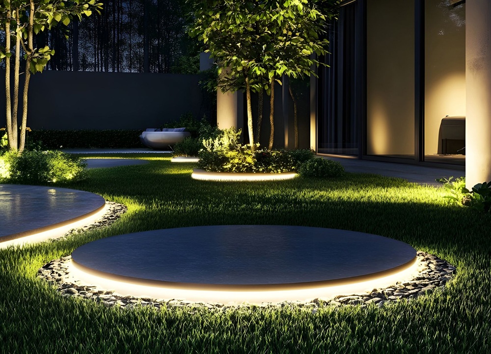 Contemporary yard with accent lighting showing a landscape light change for improved curb appeal.